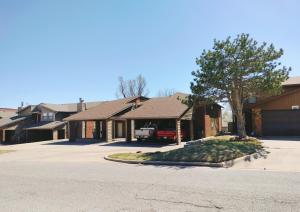 a row of houses with a tree in the driveway at Golden Sunflower's Apt A in Lawton