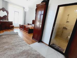 a bathroom with a shower and a mirror in a room at Guest House Dimitri in Chakvi +49 photos
