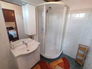a bathroom with a shower and a sink at Holiday home in Agard - Velence-See 51093 in Agárd +24 photos