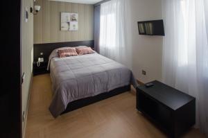 Кровать или кровати в номере Отель Спутник
