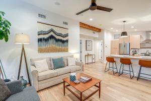 a living room with a couch and a table at Welcoming Flagstaff Condo Less Than 1 Mi to Downtown! in Flagstaff
