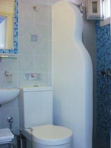 Kylpyhuone majoituspaikassa Blue Harmony Apartments