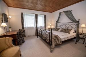 Ένα ή περισσότερα κρεβάτια σε δωμάτιο στο Dalby Hotel