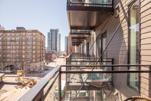 a balcony with stairs on the side of a building at Modern East Side 1BR Apt with Balcony, Pool, and Gym in Milwaukee +44 photos