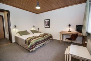 Ένα ή περισσότερα κρεβάτια σε δωμάτιο στο Dalby Hotel