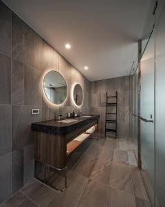 a bathroom with a large sink and a mirror at Crownshine Resort in Jiaoxi