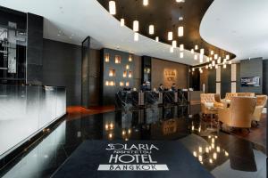 a lobby of a hotel with chairs and a table at Solaria Nishitetsu Hotel Bangkok in Bangkok +55 photos