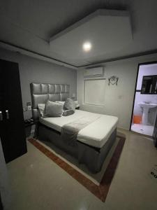 Voodi või voodid majutusasutuse Hotel Plaza Norte Cali toas