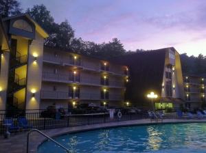 a hotel with a pool in front of a building at Sidney James Mountain Lodge in Gatlinburg +69 photos