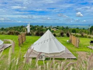 a white tent in the middle of a field at โอโซนสตอรี่ in Ban Fai Mon