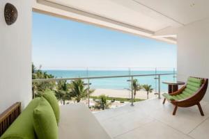 a living room with a view of the beach at W Bali - Seminyak in Seminyak