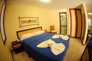 Ένα ή περισσότερα κρεβάτια σε δωμάτιο στο Solar Pipa Apartments