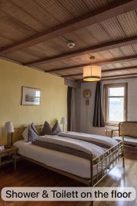 Postel nebo postele na pokoji v ubytování BnB SchlafSchloss