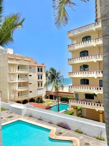 a view of the hotel and the swimming pool at Marina del Sol 402 Vista al Mar in Mazatlán +10 photos