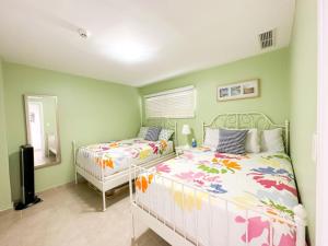 a bedroom with two beds and a mirror at Marbella, Juan Dolio, Republica Dominicana in Juan Pedro +22 photos