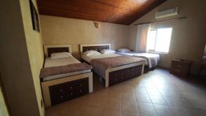 Postel nebo postele na pokoji v ubytování Alen Bar Hotel