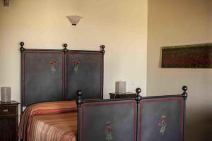 Łóżko lub łóżka w pokoju w obiekcie Azienda Agrituristica Alcastlè