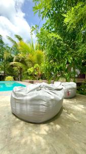 a large white inflatable raft sitting next to a pool at Richards Cabanas in Tissamaharama