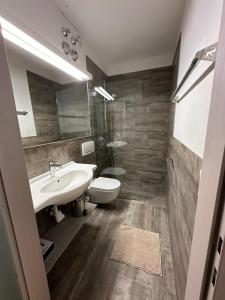 Koupelna v ubytování Apartment Haus am See + 37 fotografií