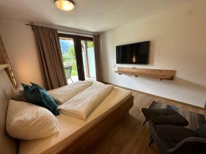 TV a/nebo společenská místnost v ubytování Apartment Haus am See