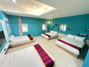 Postel nebo postele na pokoji v ubytování 安可的家 小孩及寵物免費 恆春老街夜市 屏東縣民宿0497