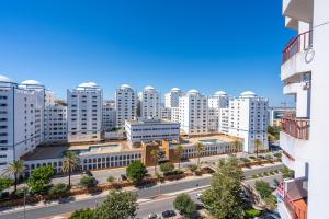 an aerial view of a city with tall buildings at Karol Vaz 4 in Portimão