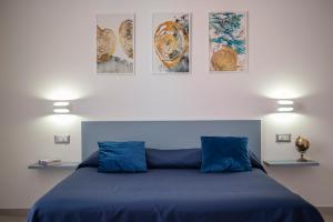 A bed or beds in a room at Dimora Asmara 11 15