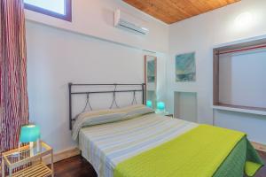 Posteľ alebo postele v izbe v ubytovaní Villa piscina a due passi dal mare