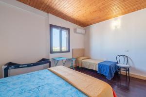 Posteľ alebo postele v izbe v ubytovaní Villa piscina a due passi dal mare