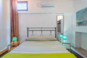 Posteľ alebo postele v izbe v ubytovaní Villa piscina a due passi dal mare