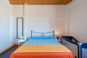 Posteľ alebo postele v izbe v ubytovaní Villa piscina a due passi dal mare