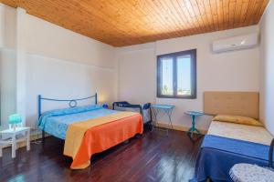 Posteľ alebo postele v izbe v ubytovaní Villa piscina a due passi dal mare