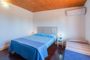 Posteľ alebo postele v izbe v ubytovaní Villa piscina a due passi dal mare