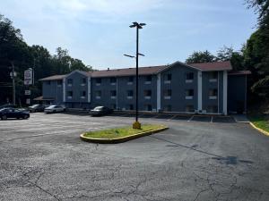an empty parking lot in front of a building at Raceway inn in Martinsville +3 photos