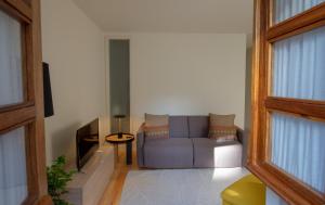 a living room with a couch and a tv at GuestReady - Catorze de Outubro Houses - 387 in Vila Nova de Gaia +22 photos