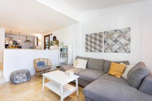 a living room with a couch and a table at Casita Seafront Oasis del Sur in San Miguel de Abona