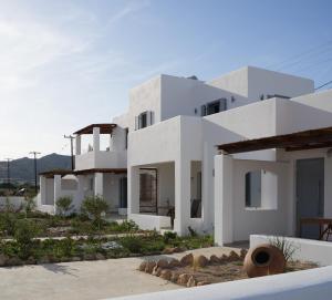 a white villa with a view at Pyrra apartments in Skiros