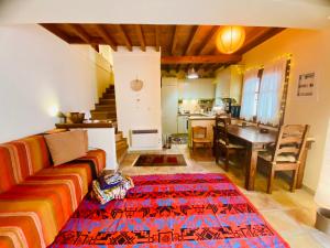 a living room with a couch and a table at Wake-up-by-the-sea! in Nydri
