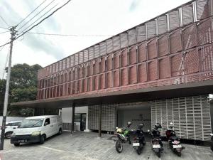 a group of motorcycles parked outside of a building at The Samirono in Yogyakarta