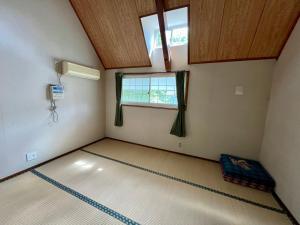 Postel nebo postele na pokoji v ubytování レンタルコテージサントロペ