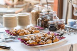 a table with two plates of pastries on a table at Hotel Can Simo in Alcudia