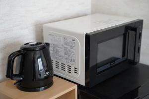 Příslušenství pro přípravu čaje a kávy v ubytování The Hakuba Station Room