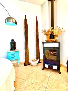 a room with a stove in the corner of a room at Villa Venus Privacy & Relax in Mošćenička Draga
