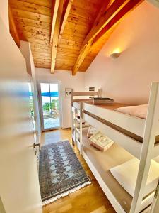 a room with two bunk beds and a doorway at Villa Venus Privacy & Relax in Mošćenička Draga +42 photos