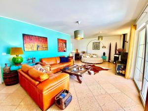 a living room with a couch and a table at Villa Venus Privacy & Relax in Mošćenička Draga