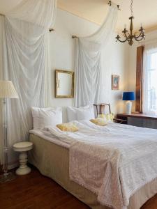 Postel nebo postele na pokoji v ubytování Hotel Onni