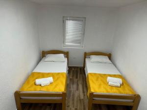 Postel nebo postele na pokoji v ubytování RiO Apartmani