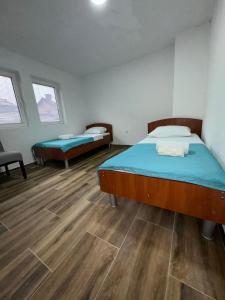 Postel nebo postele na pokoji v ubytování RiO Apartmani