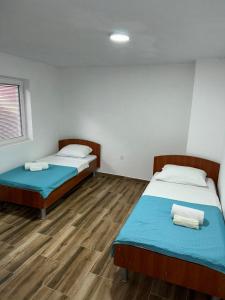 Postel nebo postele na pokoji v ubytování RiO Apartmani + 18 fotografií