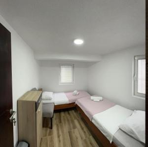Postel nebo postele na pokoji v ubytování RiO Apartmani